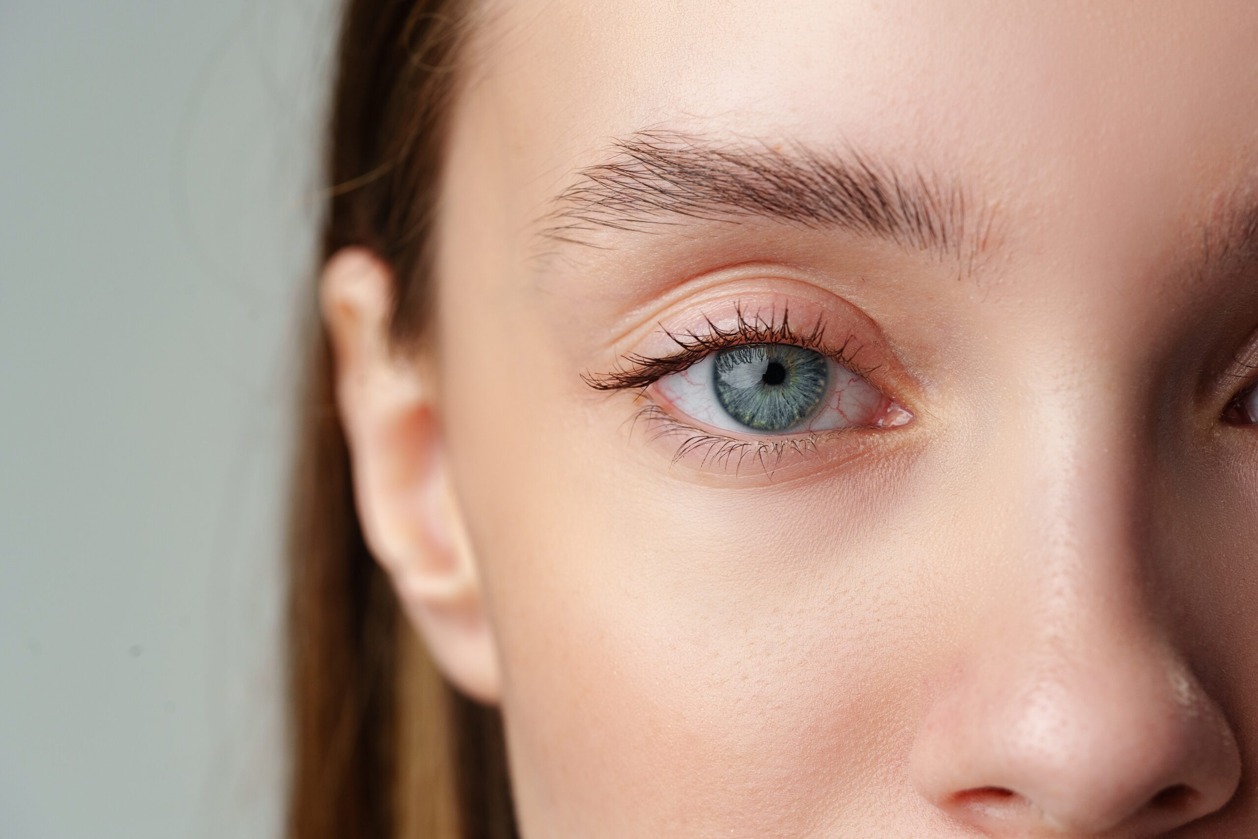 Close up of woman's blue eyes with natural makeup